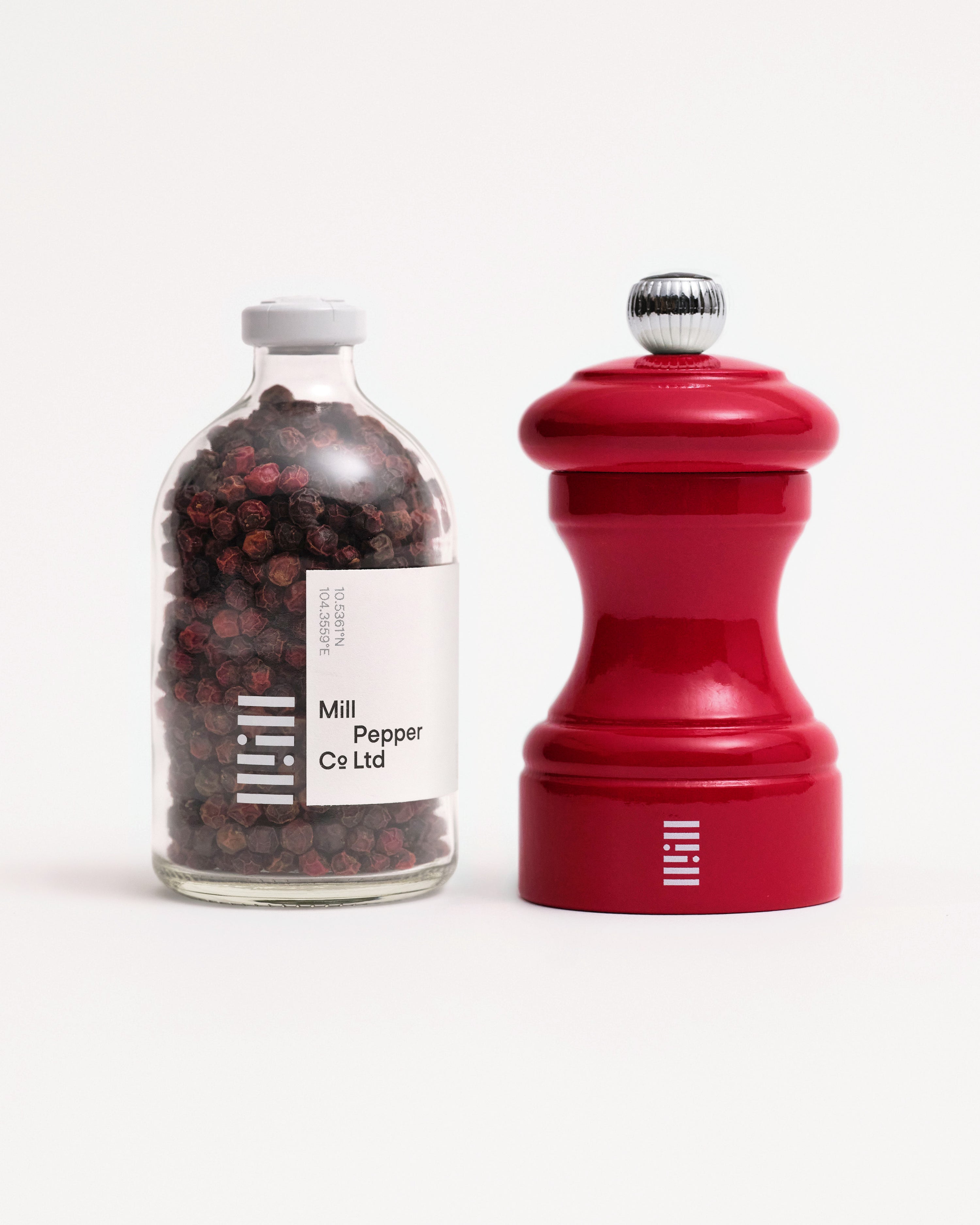 Red kampot peppercorns and red peugeot mill set.
