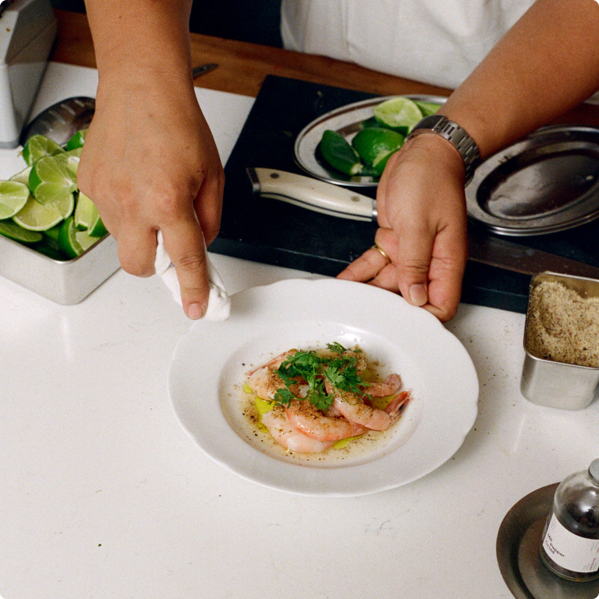 Poached Shrimp being plated.